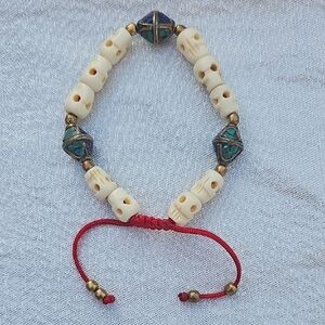 Handcrafted Beaded Bracelet with Red Cord